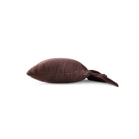 Side profile of chestnut brown ruffle cushion showing depth and ruffled edge
