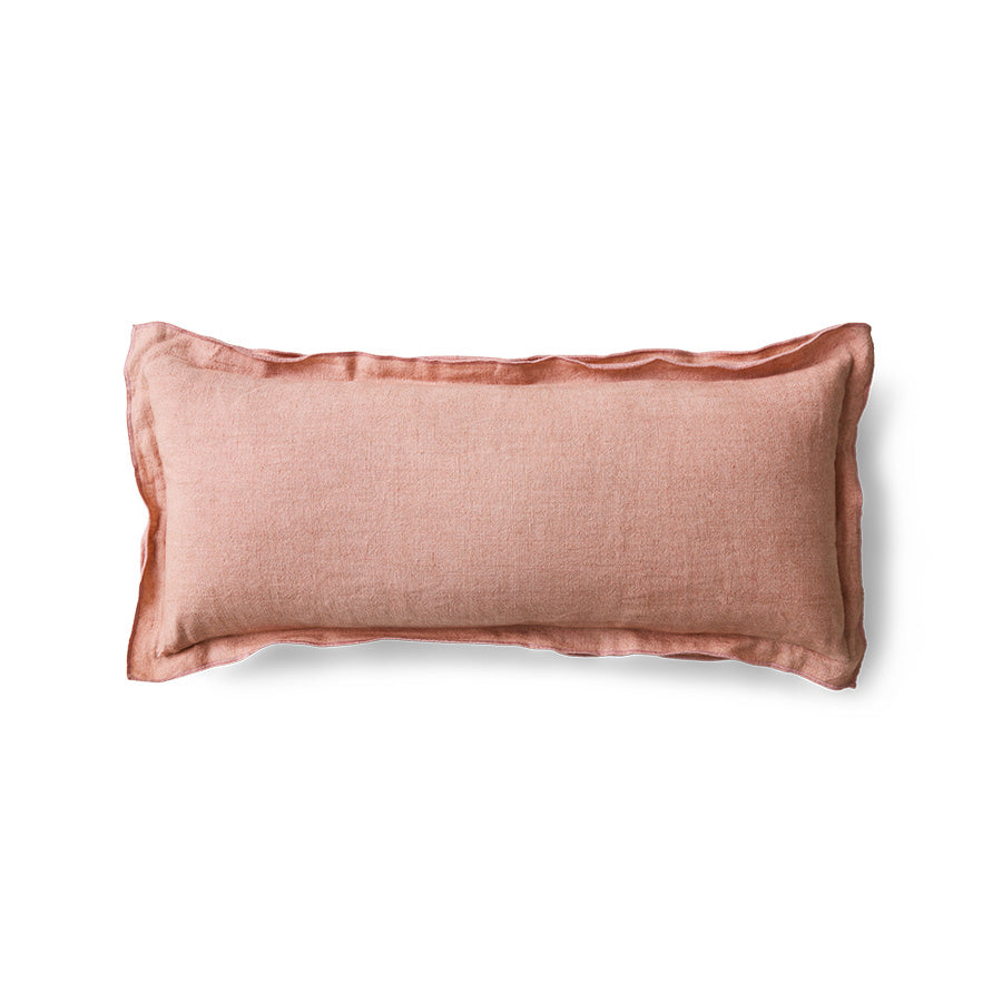 Dusty peach linen cushion on white background