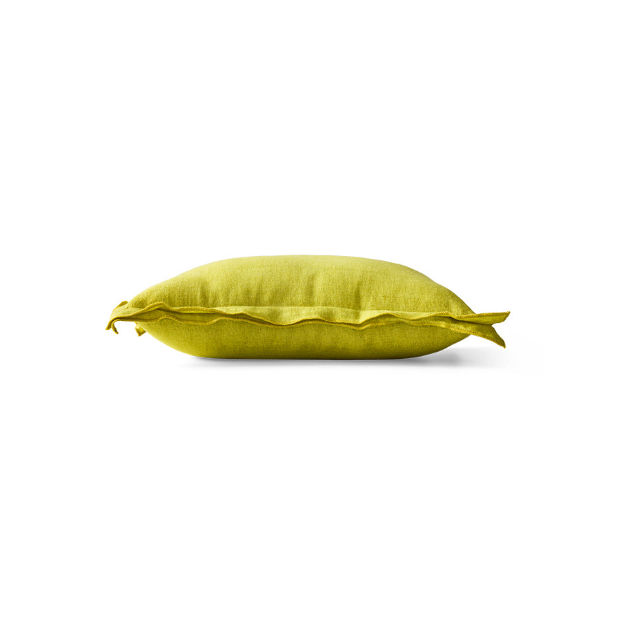 Side profile of lemongrass yellow linen cushion showing flanged edge