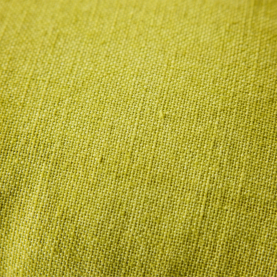 Close-up of woven linen texture on lemongrass yellow cushion