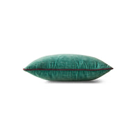 Side profile of deep sea turquoise velvet cushion showing contrast piping