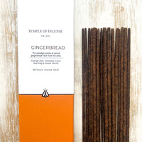 Close-up of Temple of Incense Gingerbread luxury incense sticks beside the box.