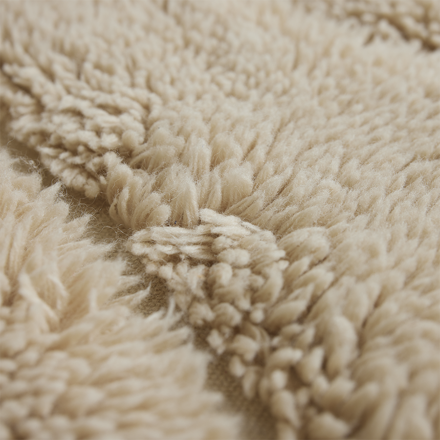 Detail of the braided cotton tassel fringe on the HKLIVING wool rug limitless