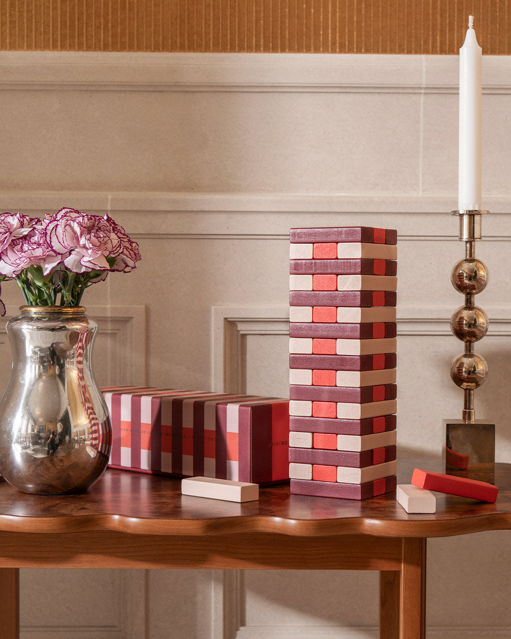 Tumbling Tower displayed with flowers and decor