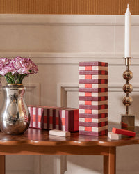 Tumbling Tower displayed with flowers and decor