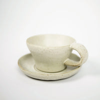 Tuva beige ceramic cup and saucer with reactive glaze by Olsson & Jensen