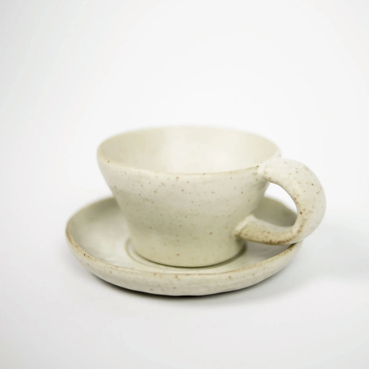 Tuva beige ceramic cup and saucer with reactive glaze by Olsson & Jensen