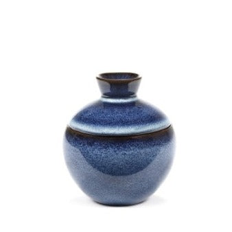 dark blue ball shaped lidded jar that has a brown tinge around where the lid meets the pot from Serax