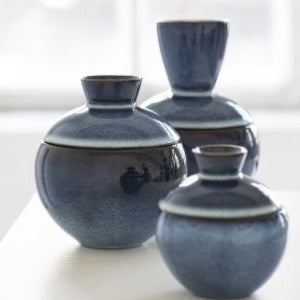 A few of the pure range of pots from serax which are almost ball shaped and the lid has almost vase growing out the top of it for a handle. Dark blue round the middle getting lighter as it goes down