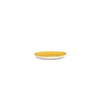 side on view of a small plate in happy yellow with a generous glaze and white base