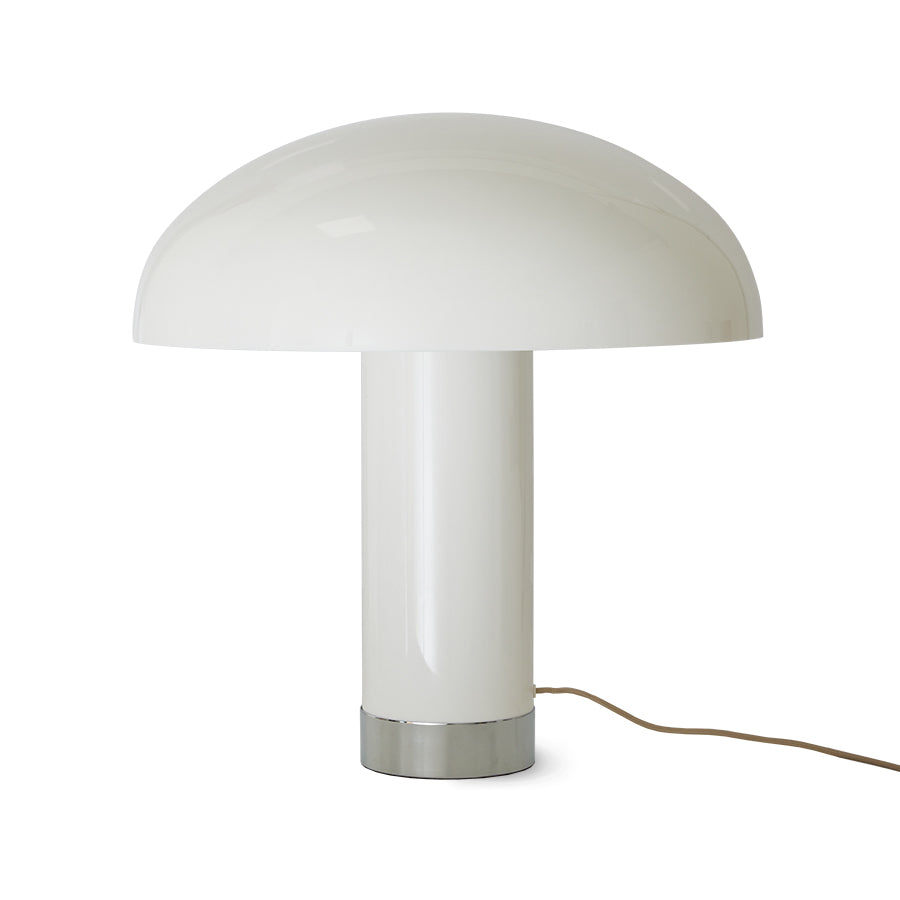 pure white mushroom lamp with a chrome colar at it's base and an hk living logo showing above the electrical cord. the smooth shiny surfaces reflect a personal interior design style