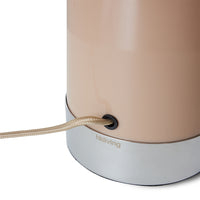 chrome base of the mocha coloured mushroom lamp with the HKLIVING logo showing just under the mocha light brown coloured electrical flex cord