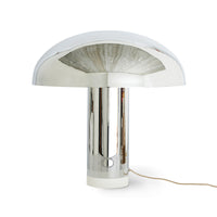 the reflective surface of a mushroom chrome lamp with a small hkliving logo near the where the cord enters the unit