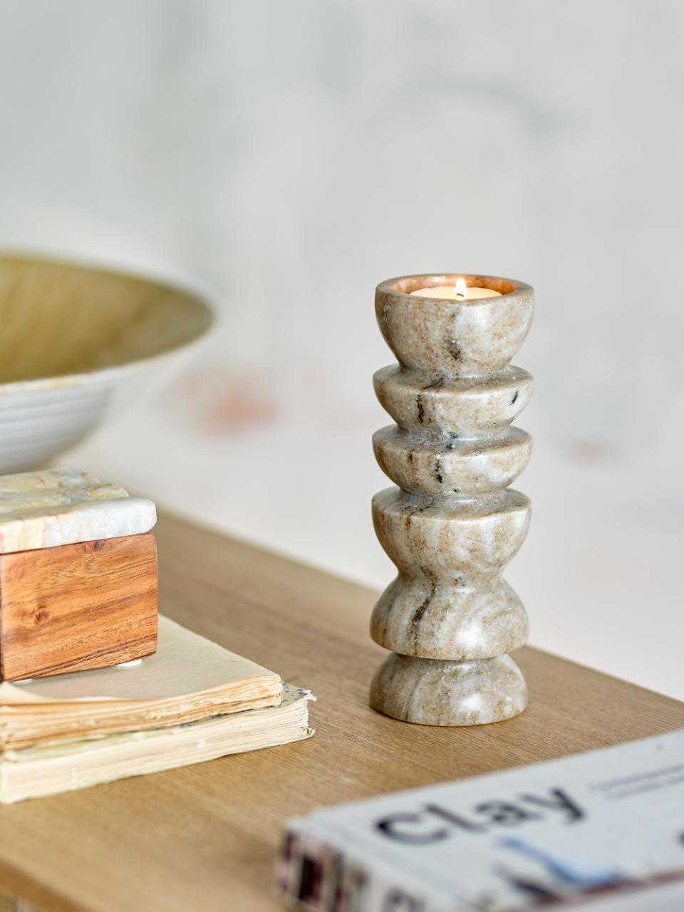 Polished marble candle holder for tealights by Bloomingville on a table