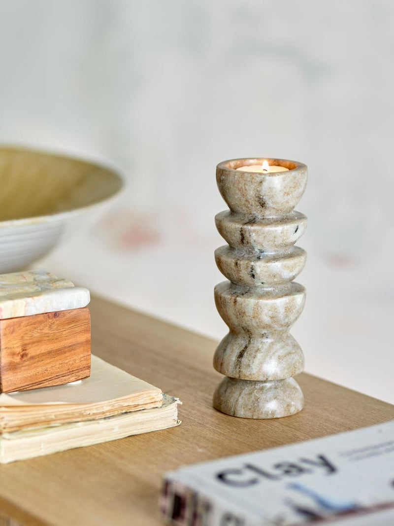 Polished marble candle holder for tealights by Bloomingville on a table