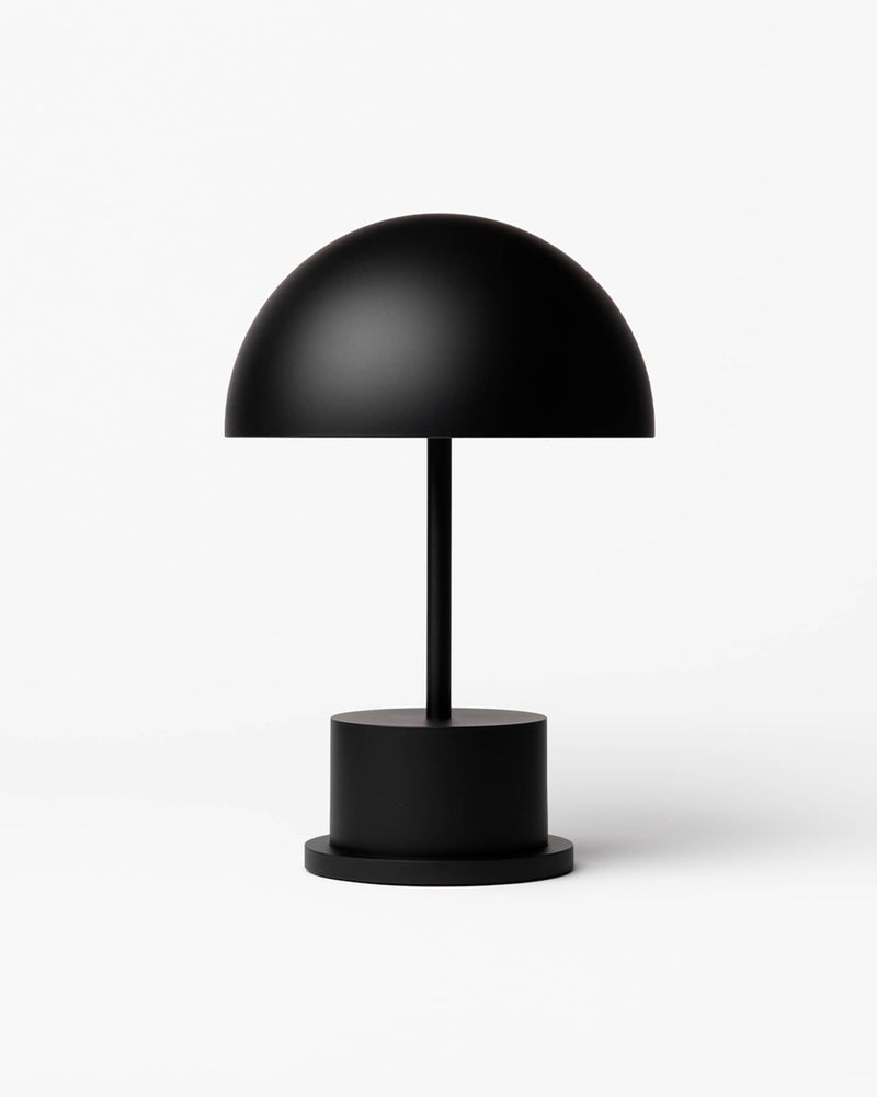 minimalist matte black rechargeable lamp with dome shade
