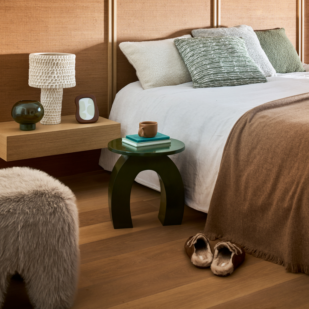 Wido photo frame styled on a bedside table in a warm bedroom