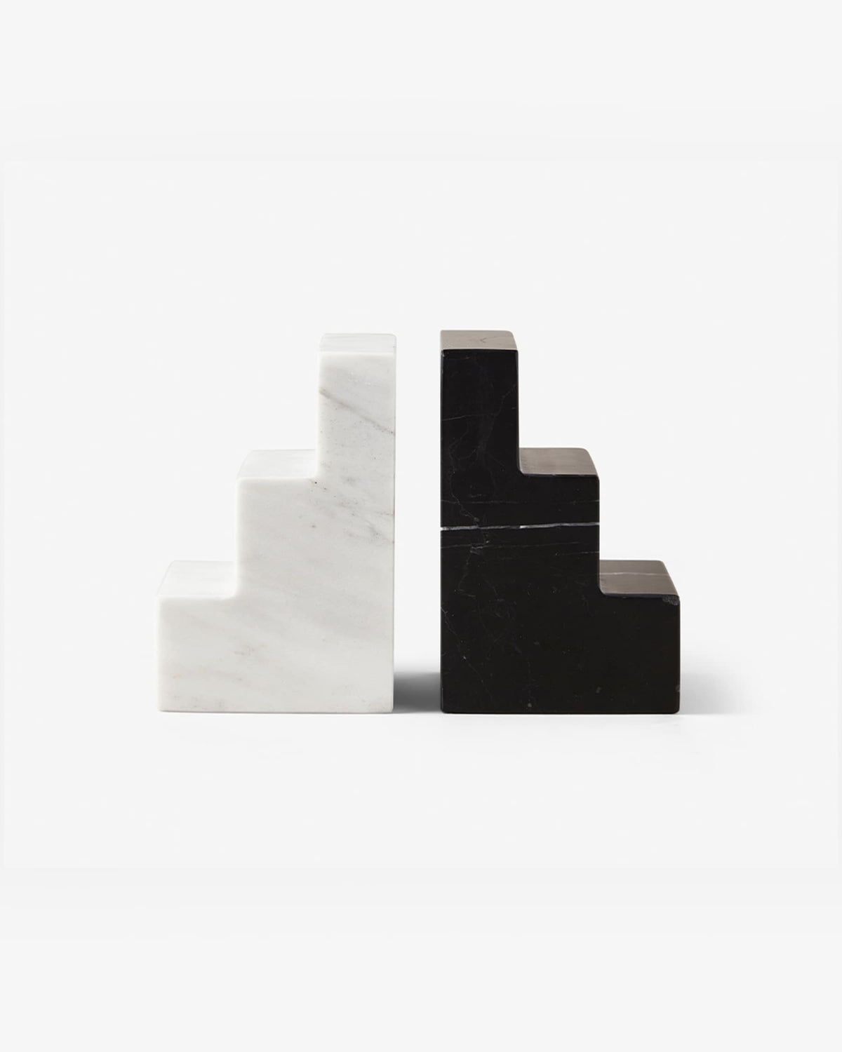 pair of black and white marble staircase bookends on white background
