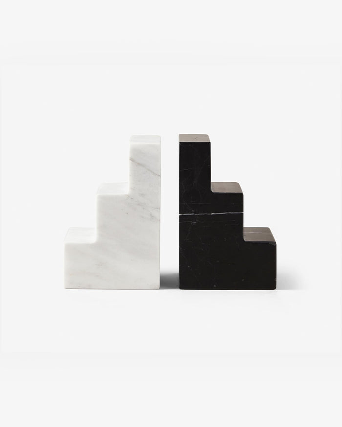 pair of black and white marble staircase bookends on white background
