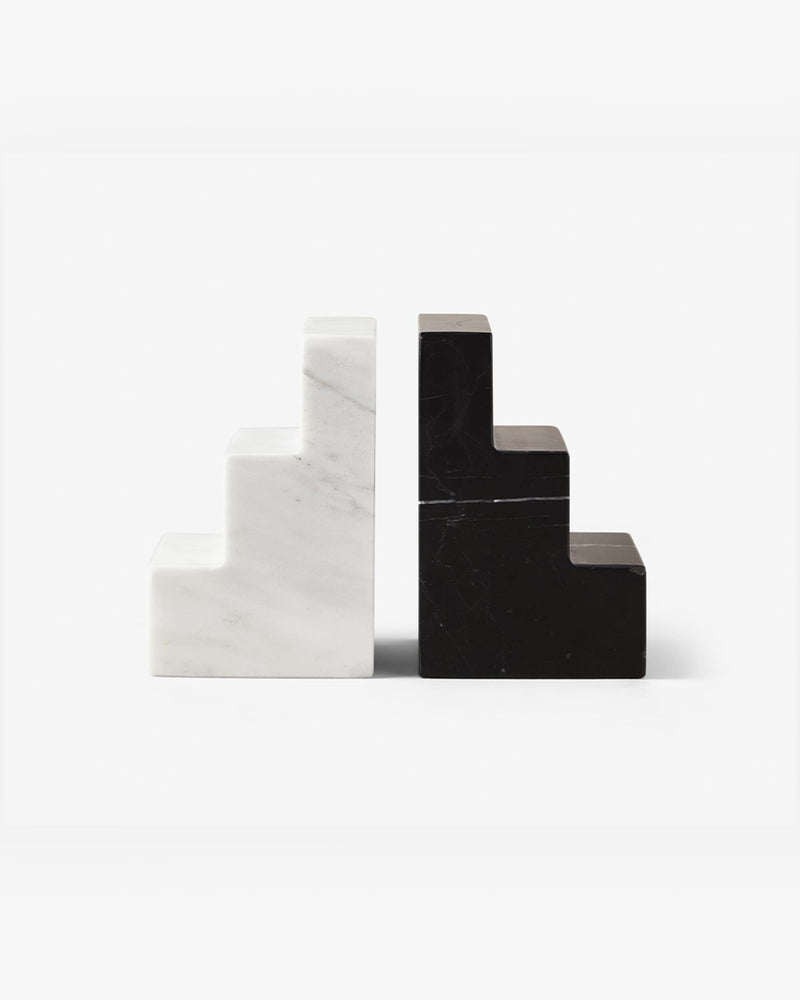 pair of black and white marble staircase bookends on white background
