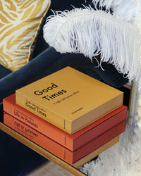 small yellow Good Times photo album stacked with other Printworks albums
