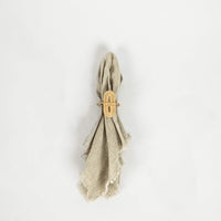 Zara oval bamboo napkin ring on a linen napkin by Olsson & Jensen