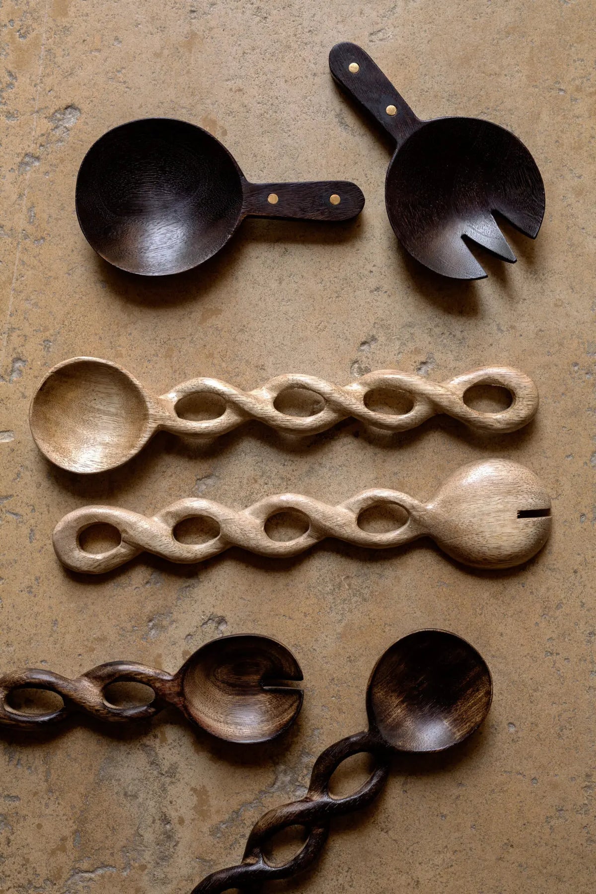 Zoey and Zen mango wood salad servers by Olsson & Jensen on a wooden board