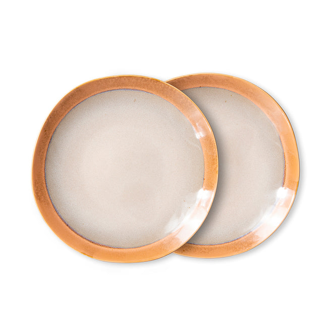 with a peachy orange rim and an off white centre seperated with a slight dark brown ring this set of 2 plates are shimmering int he light thanks to the dutch design house hkliving