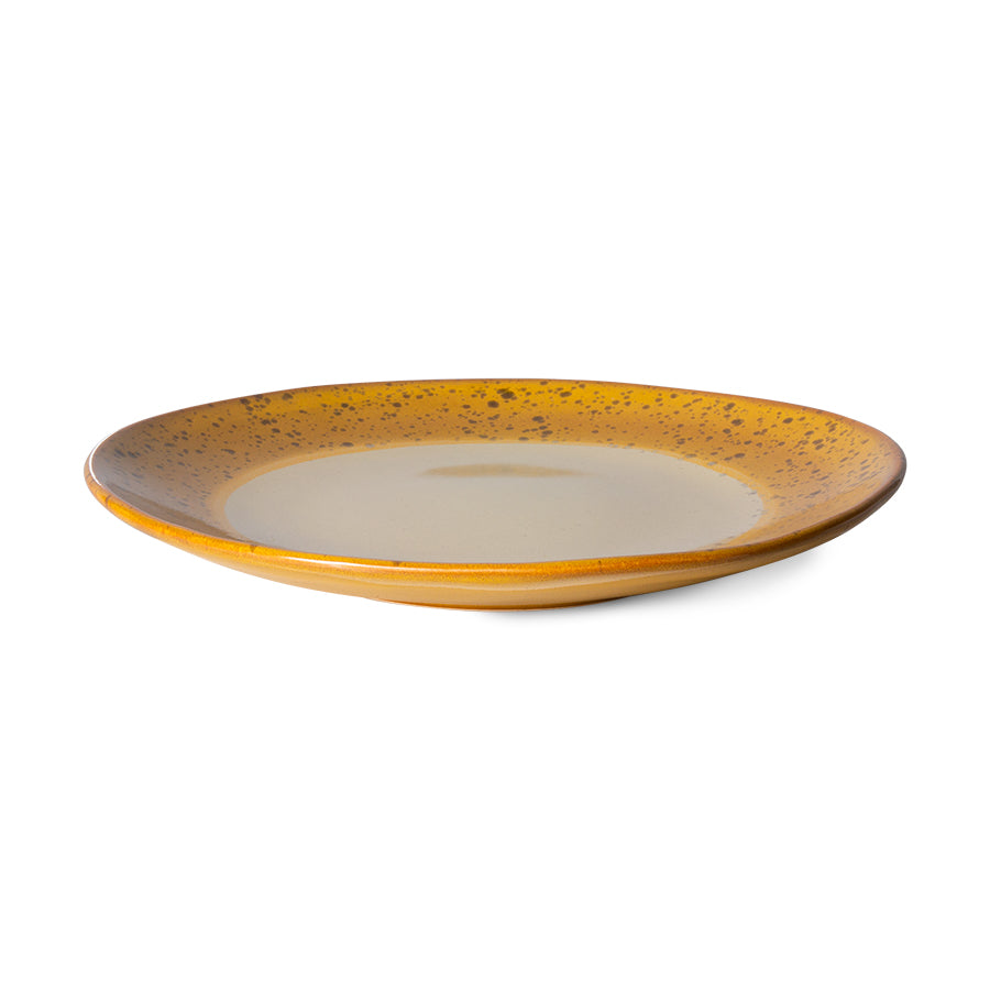 edge on view of the hkliving autumn plate which shows the deep yellow goes under the plate too