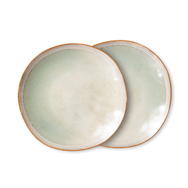 hand painted plates with a rim of orangey red and the main flat being a light green with a hint of blue. there is a speckling effect of deeper green around the edge  of these hkliving plates