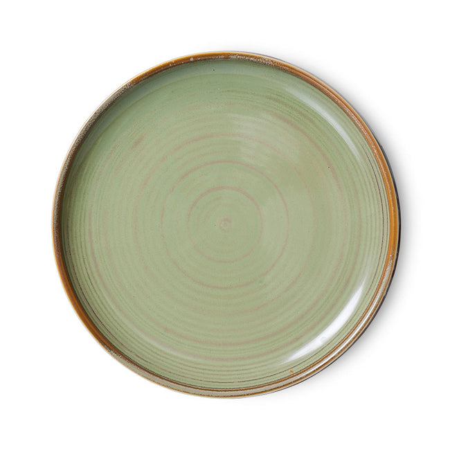 with visible brush strokes of pink, and brown on this largely green plate which run full circles thanks to HKlivings design