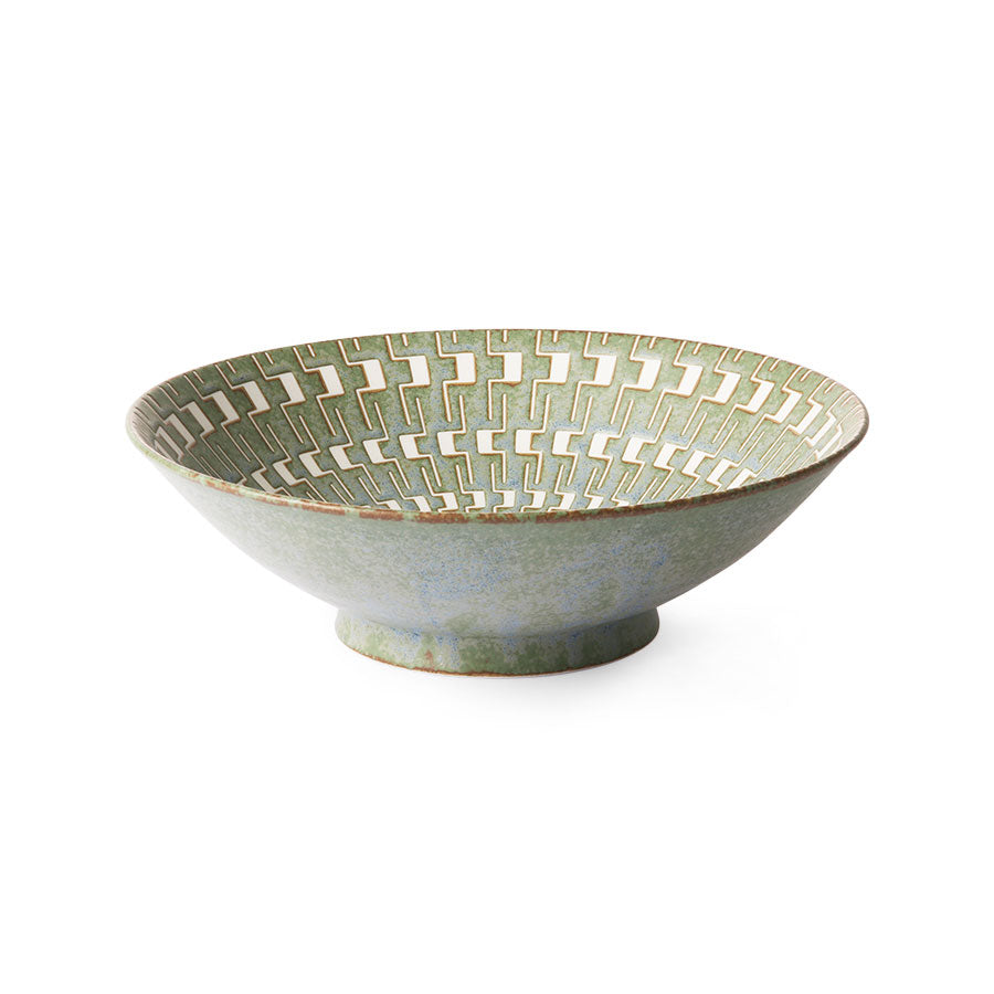 bowl with almost aztec like marks and lines in white running down the inside of this light green blue straight sided angled hkliving bowl