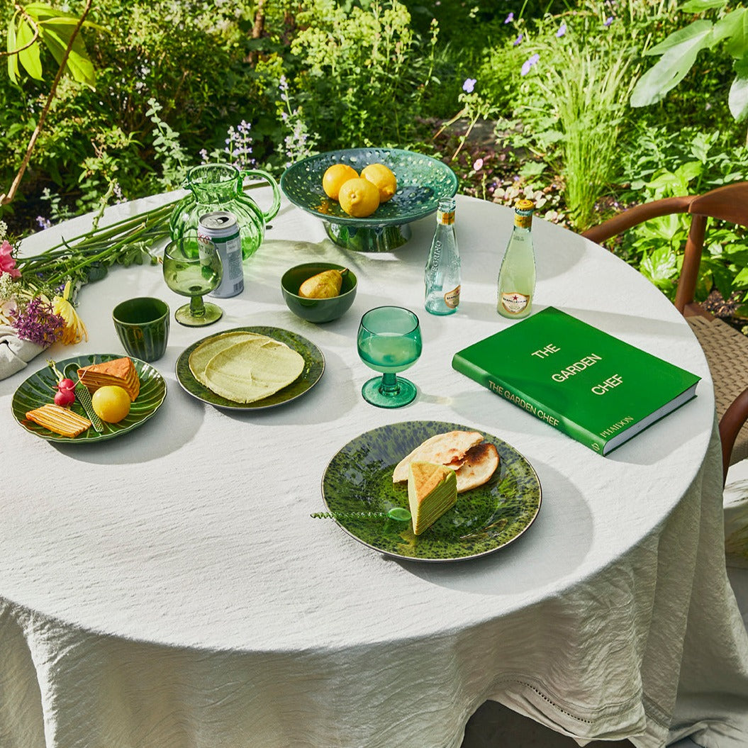 a beuatiful garden setting with a lovely picnic set-up including crockery from the hkliving emeralds green collection really hightlighting the summery aspect