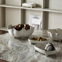 collection of decorative bowls on a grey marble table