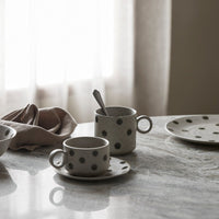 some of the green spotty collection on a grey marble table