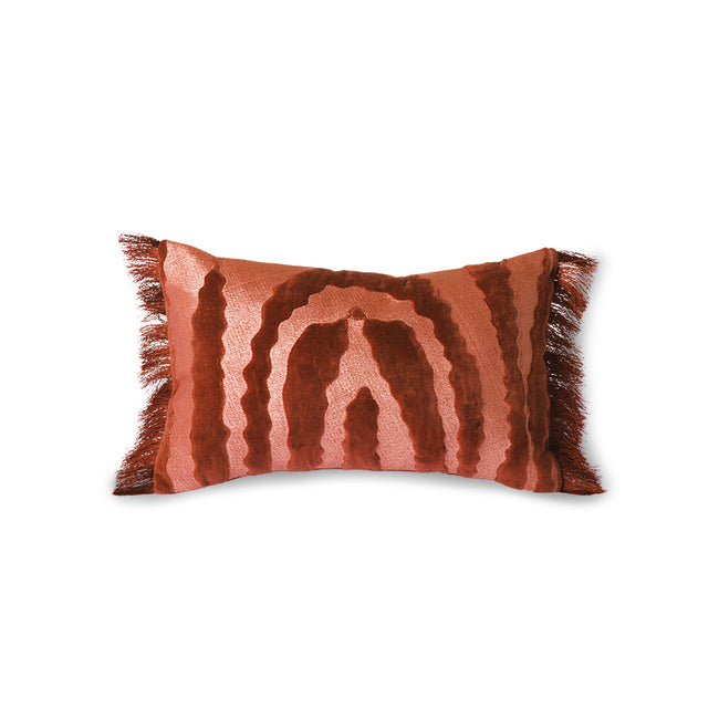 rectangular red and pink cushion with deep red tassels on the end and almost tiger like markings on a hkliving cushion