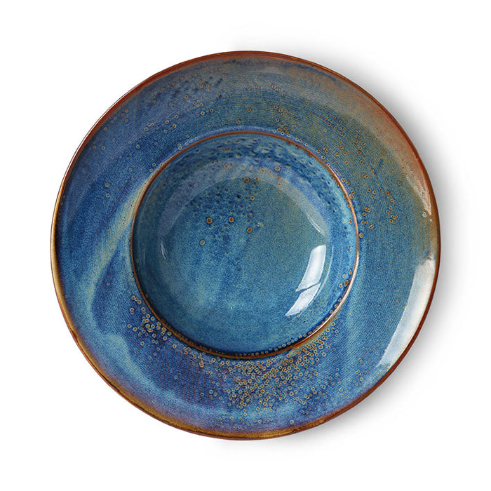 swirling blues pock marked with browns on this wide rimmed pasta bowl from hkliving chef collection with brown golds edging